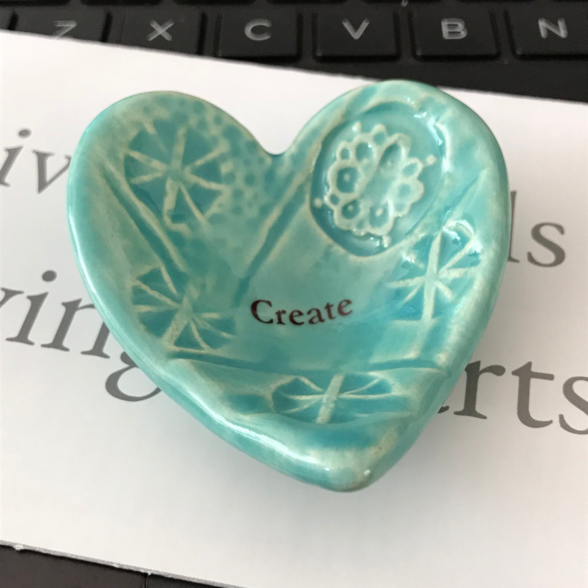 Giving Heart with the word "Create"  is a thoughtful gift for anyone who is trying something new.  Shown in turquoise glaze.  Handmade ceramic. 