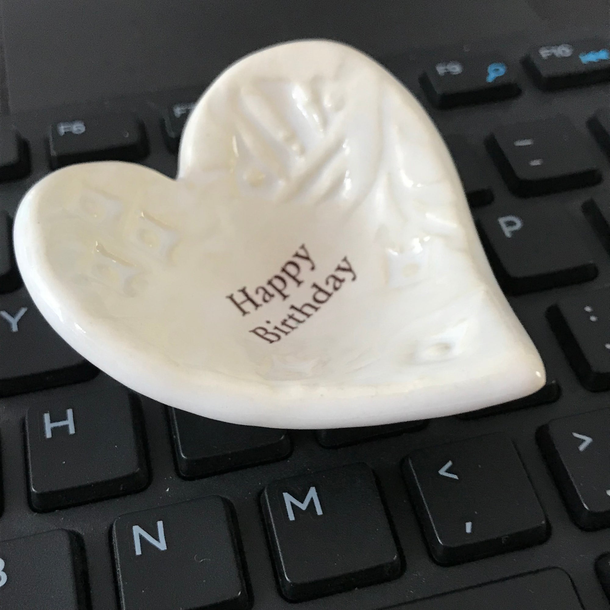 Here's a wonderful birthday gift for her.  A Giving Heart inscribed with the words "Happy Birthday".  Most people use it as a ring dish.  