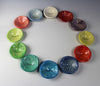 Giving Bowls in Jelly Bean colors offers a selection of 12 colors by Lorraine Oerth