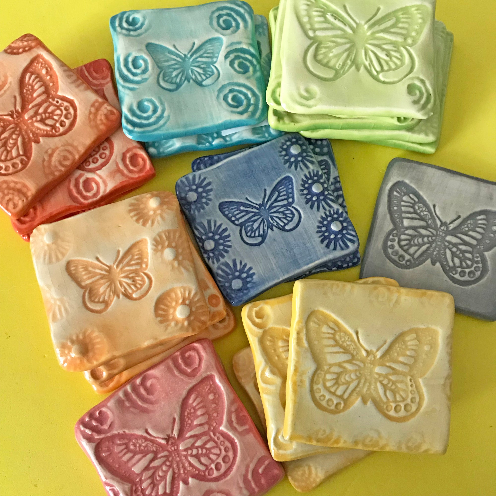 Vibrant color butterfly magnet with Lorraine Oerth's handmade stamp pressed into the soft clay.  Each is individually made and unique.