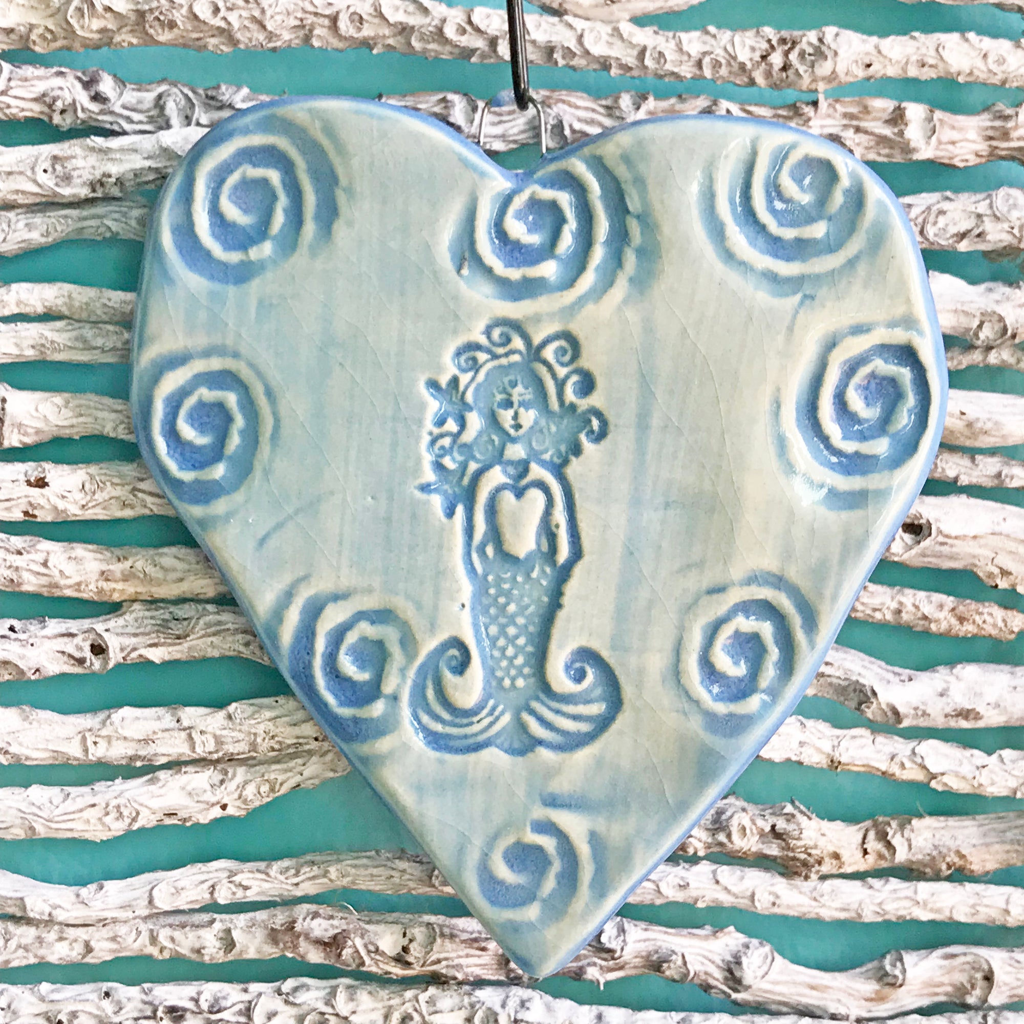 Beautiful in blue, our Mermaid Ornament is used as a tree ornament.  It also looks beautiful as decor around the home.  