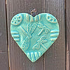 Dragonfly Heart Ornament handcrafted of  earthenware clay in a beautiful turquoise blue glaze.