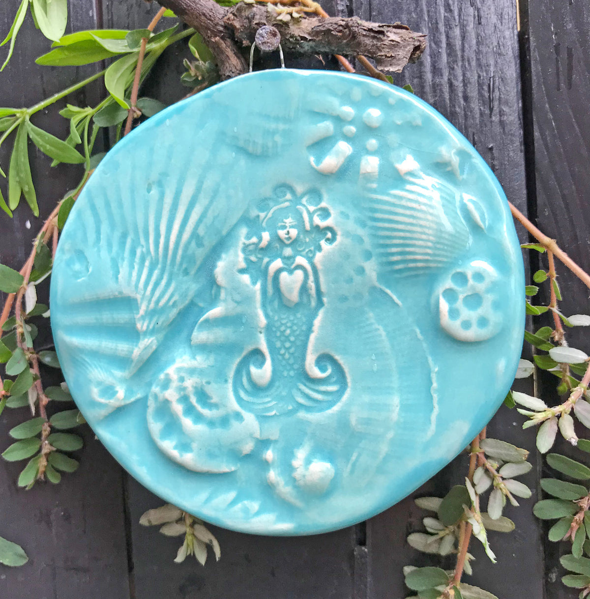 Gift for Mermaid Lovers our handmade mermaid ornament is crafted from clay that is pressed into real shells and sea life.  Then we add our mermaid drawing .  A totally unique handmade creation. 