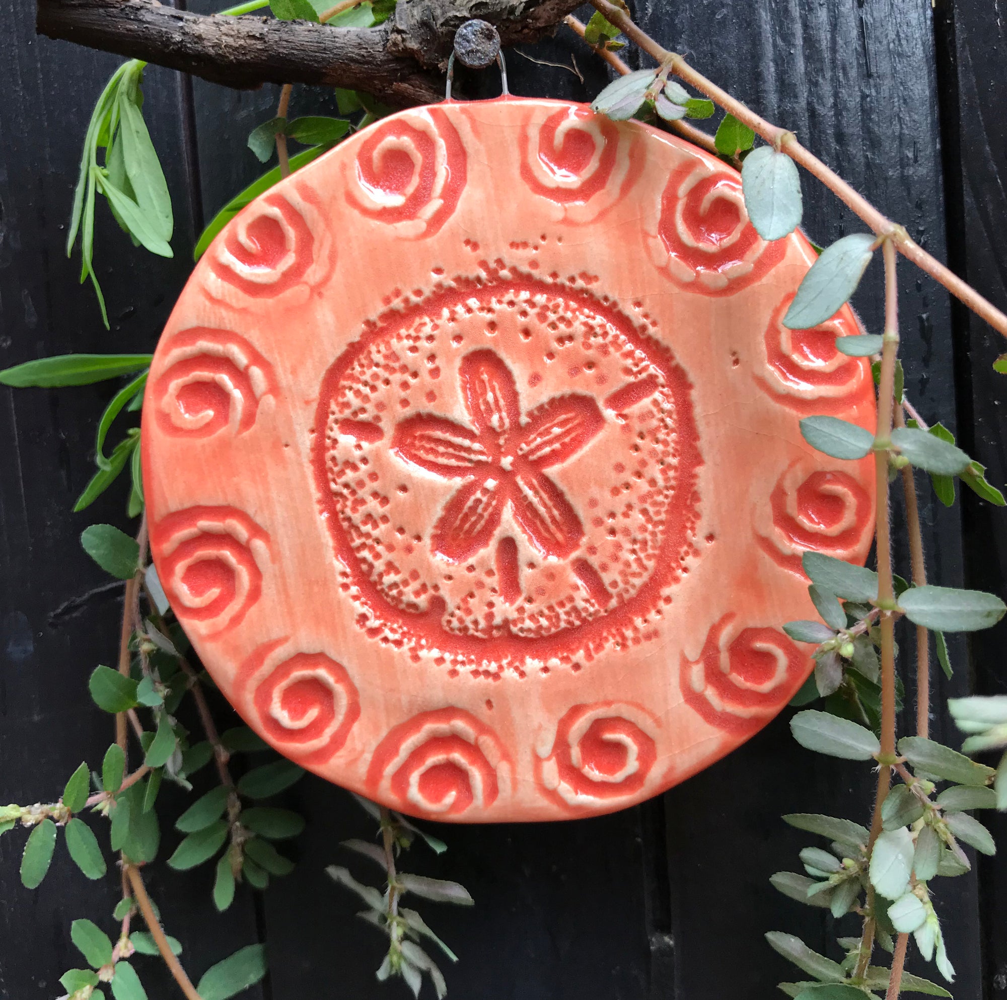 Sand Dollar Ornament in beautiful coral glaze.  A thoughtful gift for beach lovers and nature lovers.