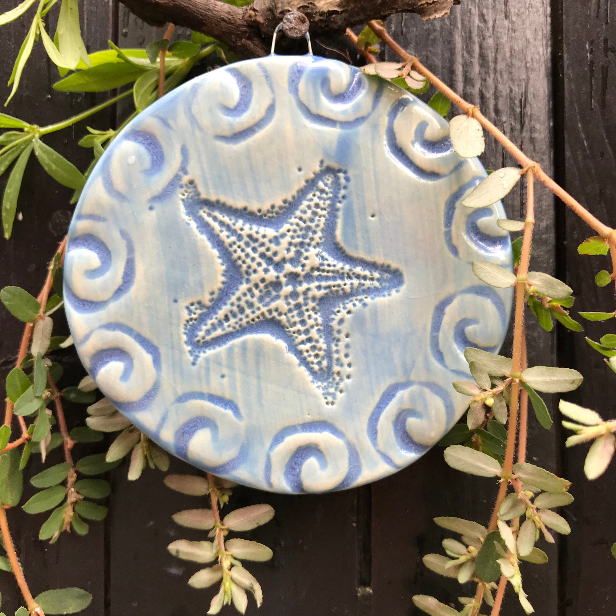Beautiful nautical blue glaze accentuates the detail of our handmade Starfish Ornament.  Makes a great gift for Christmas or year round. 