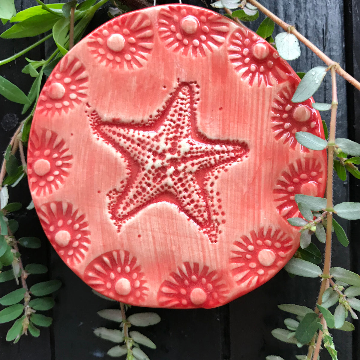 Our starfish ornament in red glaze is ready for the Christmas Tree.   Handmade and each varies.