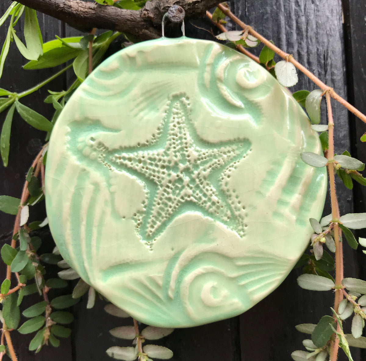 Starfish Ornament handmade of earthenware clay by the artisans of Oerth Studio.  One of a kind.