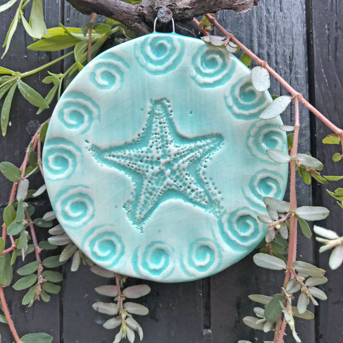 Our starfish ornament, glazed in turquoise blue, looks wonderful on the Christmas Tree but also serves as a year round decoration.  Each varies.