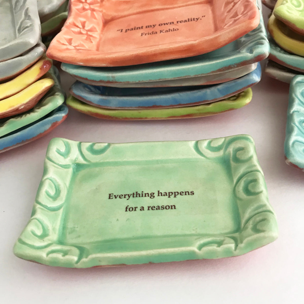 "Everything happens for a reason" quote on handmade ceramic dish.  