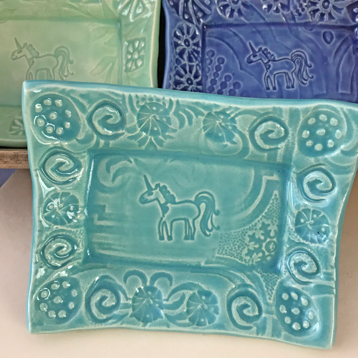 Unicorn Dishes designed for collectors.  Inspired by unicorn images from ancient times, including roman coins, Christian symbolism and manuscripts.  Handmade ceramic. 